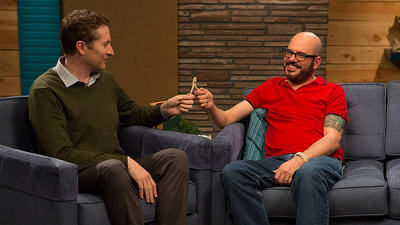 David Cross Wears A Red Polo Shirt & Brown Shoes With Red Laces Summary